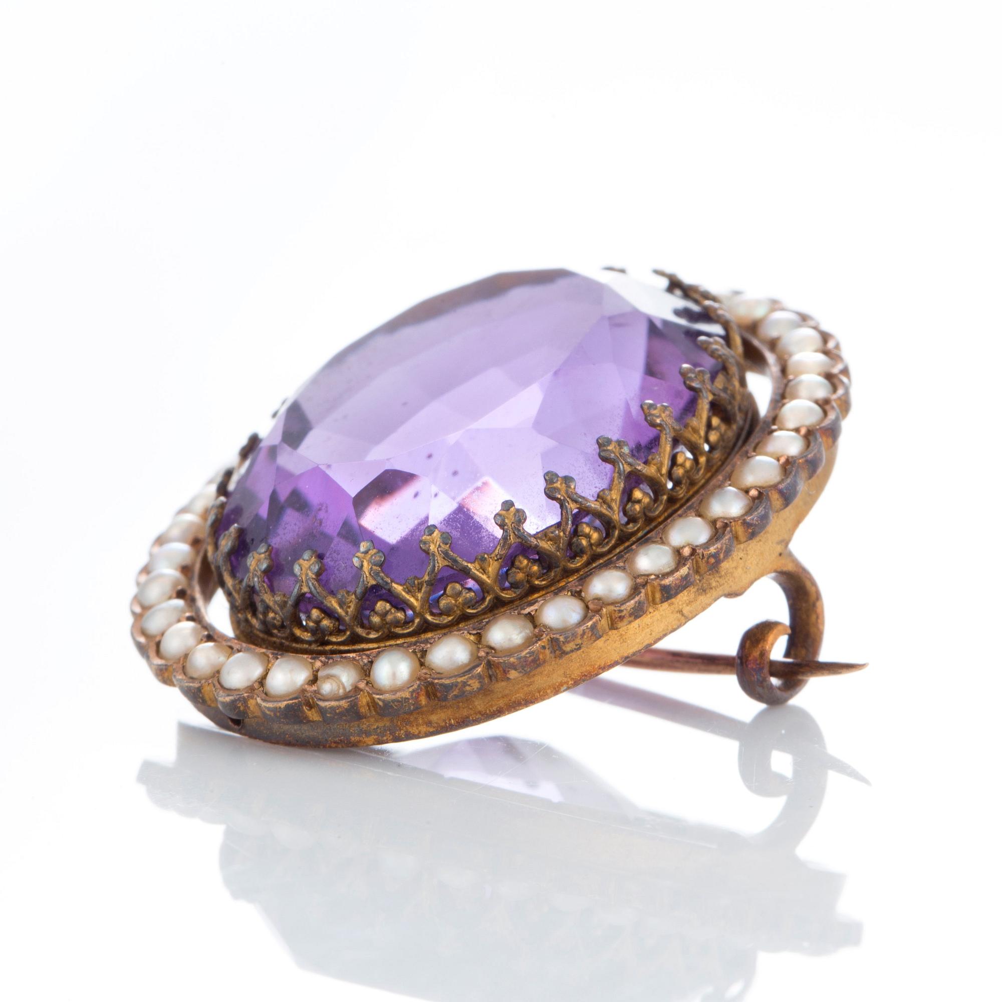 An amethyst brooch set with pearls.
