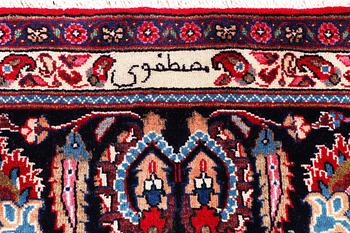 A Kashan carpet, signed, c. 358 x 244 cm.