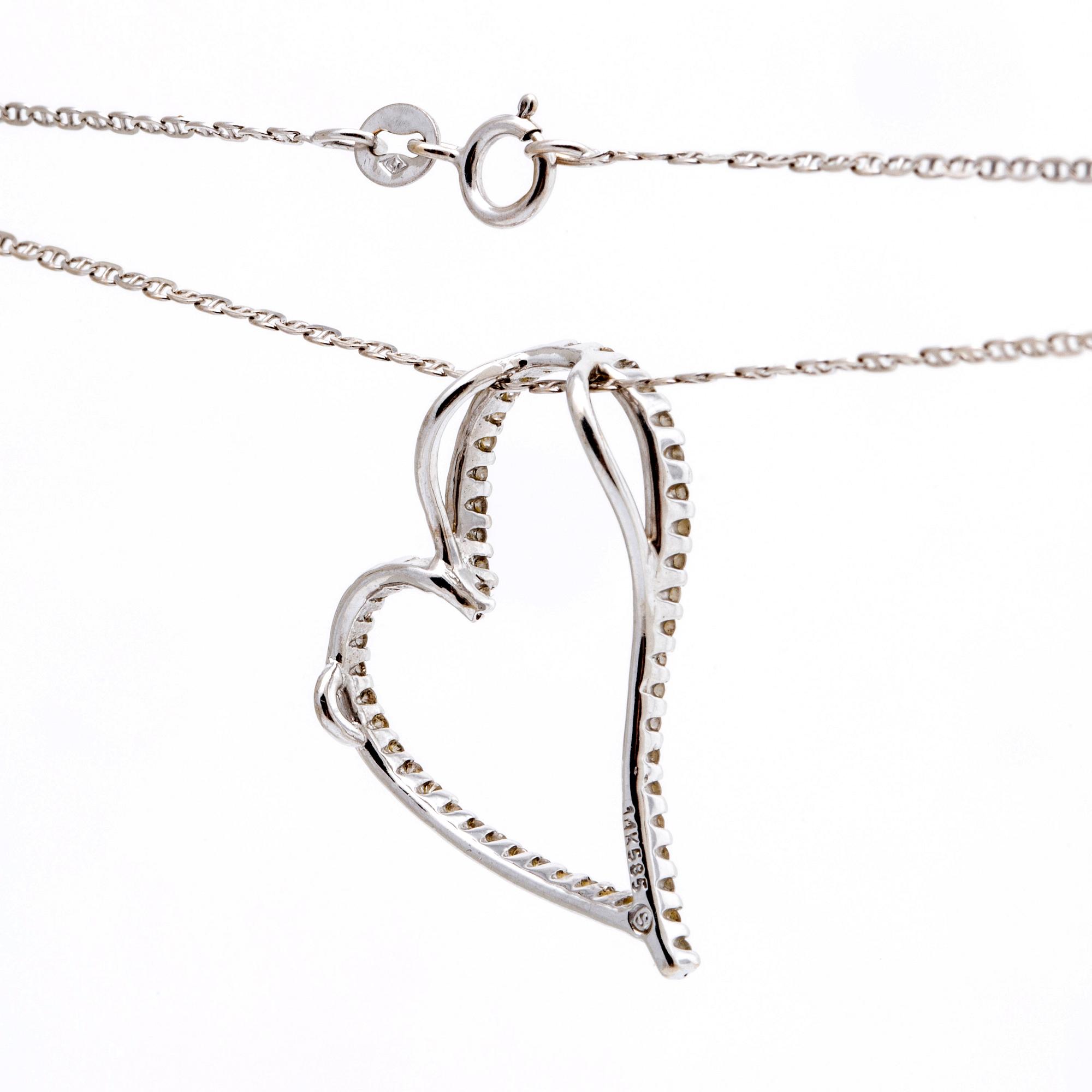 Pendant and chain, 14K whitegold brilliant-cut Diamonds, total length approx 48 cm.