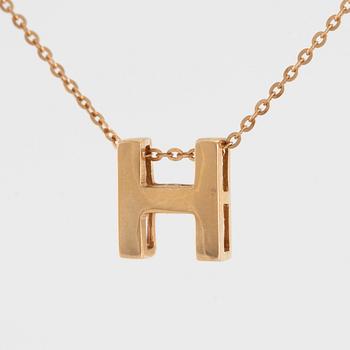 Collier, 18K guld med en berlock av bokstaven H.