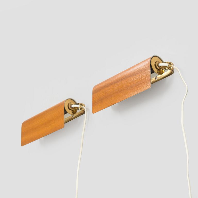 A pair of mid-20th century model 2317 wall lights by Valinte.