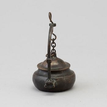 An 18th century bronze oil lamp.