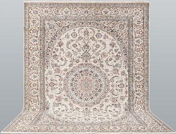 A Nain part-silk carpet, 395 x 293 cm.