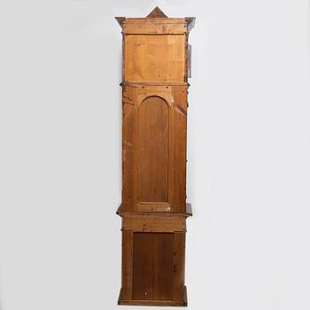 A long-case clock, late 19th century.