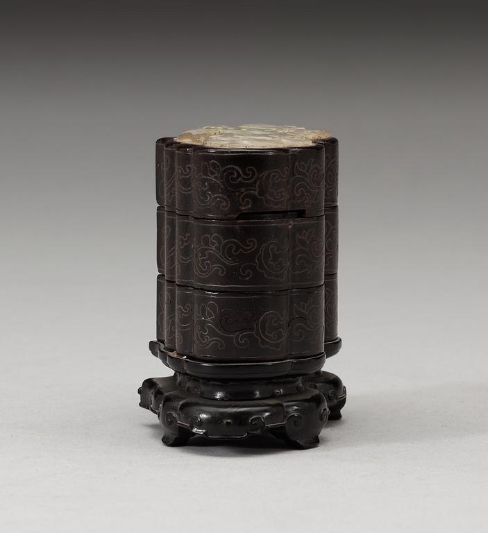 A three tiered wooden silver-inlayed box with cover, Qing dynasty.