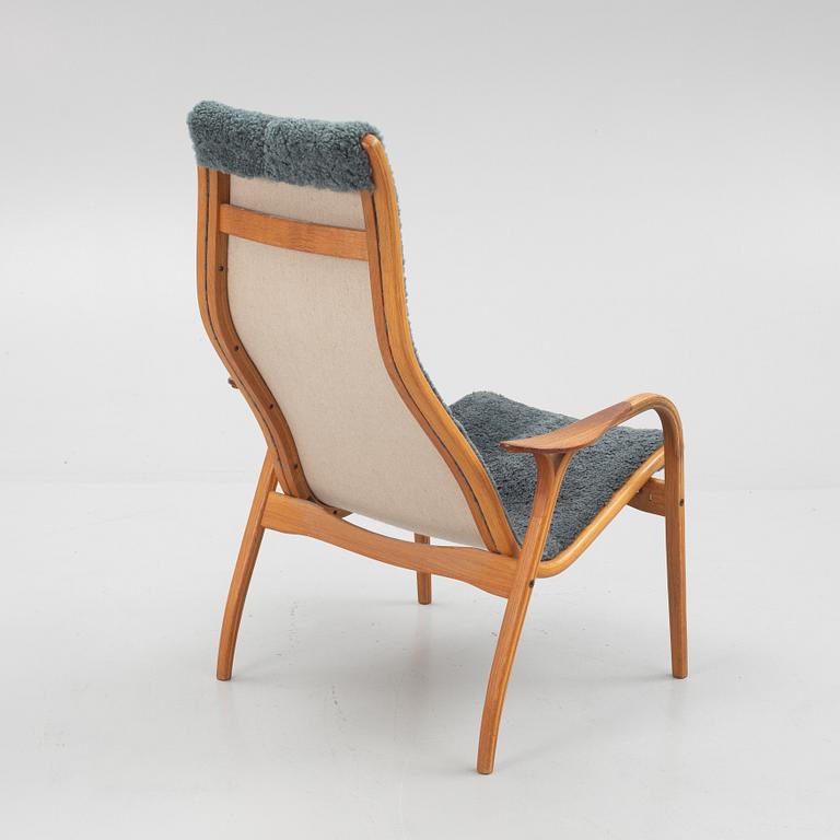 Yngve Ekström, a "Lamino" armchair with ottoman, Swedese, Sweden.