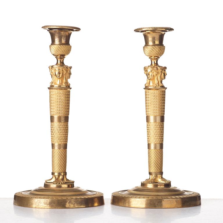 A pair of French Empire candlesticks, early 19th century.