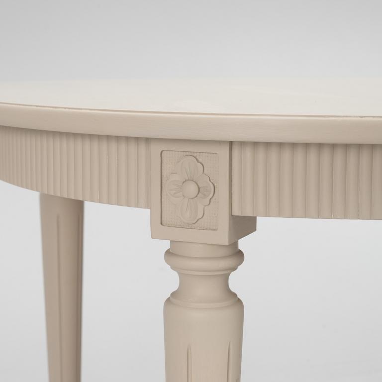 A Gustavian Style Dining Table and 10 Chairs, second half of the 20th Century.
