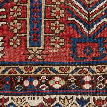 An antique carpet, probably Shirvan, c. 330 x 172 cm.