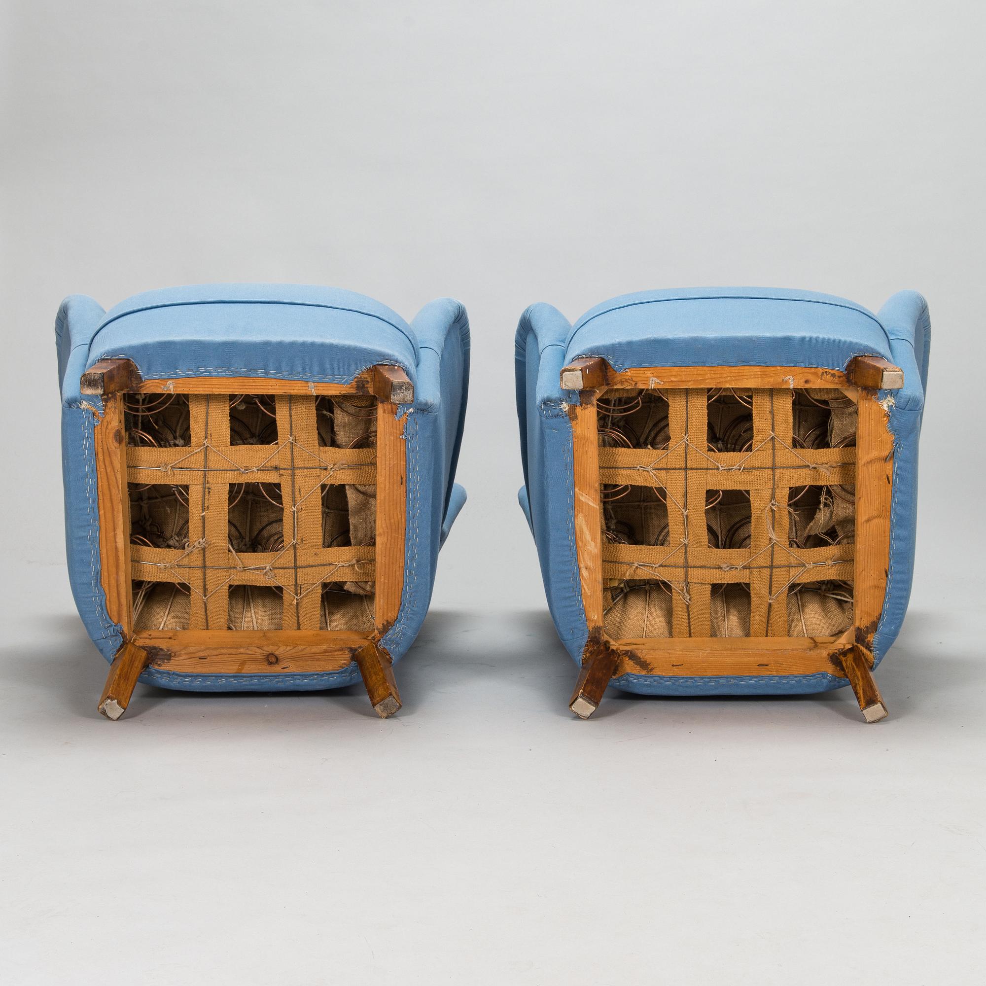 A pair of mid-20th-century armchairs.