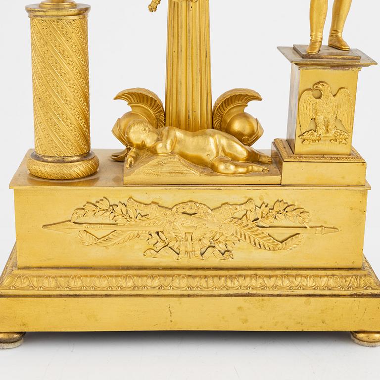 A French Empire ormolu figural mantel clock, early 19th century.