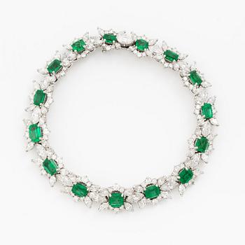 A bracelet in 18K white gold with step-cut emeralds and round and navette-shaped brilliant-cut diamonds.