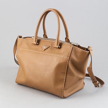 Prada, a leather handbag.