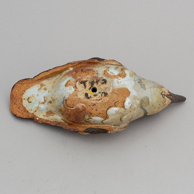 TYRA LUNDGREN, a stoneware sculpture of a bird, signed.