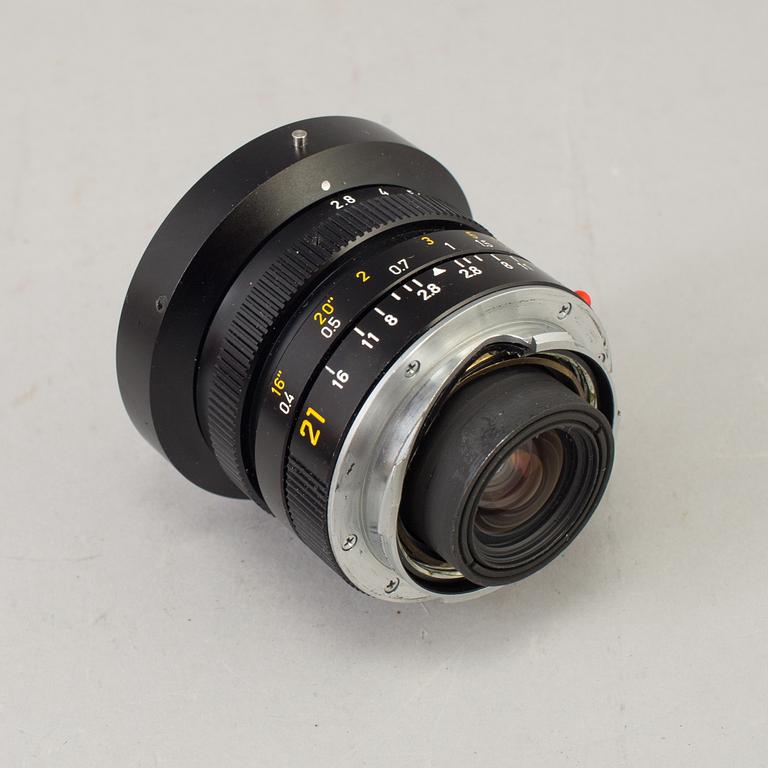 A black Leica Elmarit -M 1:2.8/21 no 3211824 from Leitz Canada with viewfinder and original box.