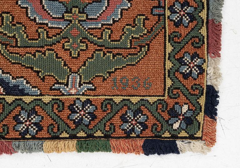 A sleigh cushion, signed BB and dated 1936, c. 160 x 67 cm.