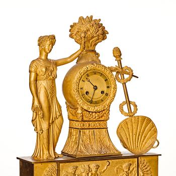 A French Empire gilt bronze mantel clock, 19th century.