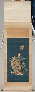 A blue ground kesi hanging scroll, depicting Xi Wangmu with a Jade girl and Phoenix, Qing dynasty, 19th Century.