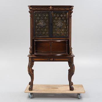 A Baroque style drinks cabinet, first half of the 20th Century.