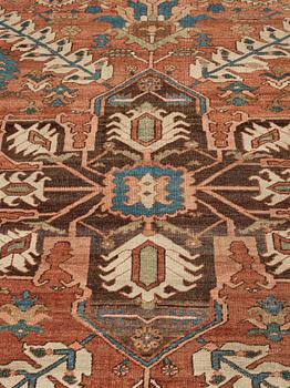 A carpet, an antique Heriz, ca 454,5-460,5 x 268-285 cm.