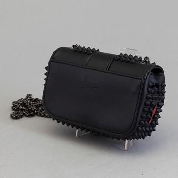An eveningbag with studs by Christian Louboutin.
