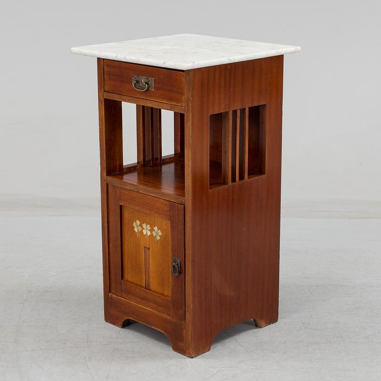 An early 20th century 'Jugend' style bedside cabinet.