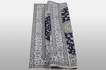 A carpet, Nain, part silk, ca 310 x 205 cm.