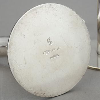 LJUSSTAKAR, ett par, nysilver, "Liljan", Ivar Ålenius Björk, Ystad metall, 1900-tal.