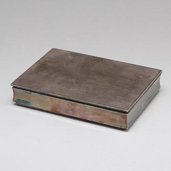 A silver cigarette case.