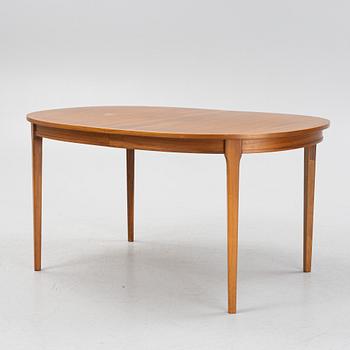 A teak-veneered dining table, second half of the 20th century.