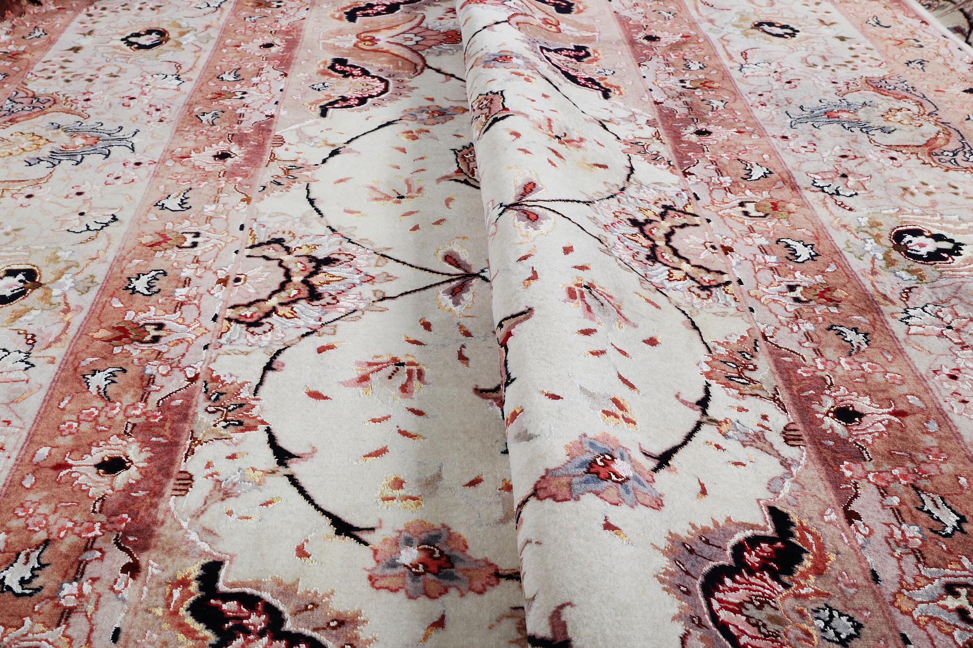A carpet, Tabriz, part silk, 50 Raj, ca 340 x 253 cm.