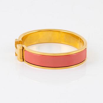 Hermès, a 'Clic H PM' bracelet.