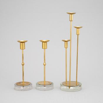 Gunnar Ander, a set of three brass and glass candlesticks from Ystad Metall.