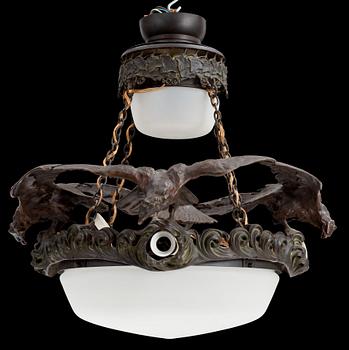 A Swedish Art Nouveau patinated bronze and patinated metal hanging lamp, reportedly designed by Ruth Milles.