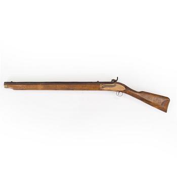 A percussion lock rifle, mid 20th century.