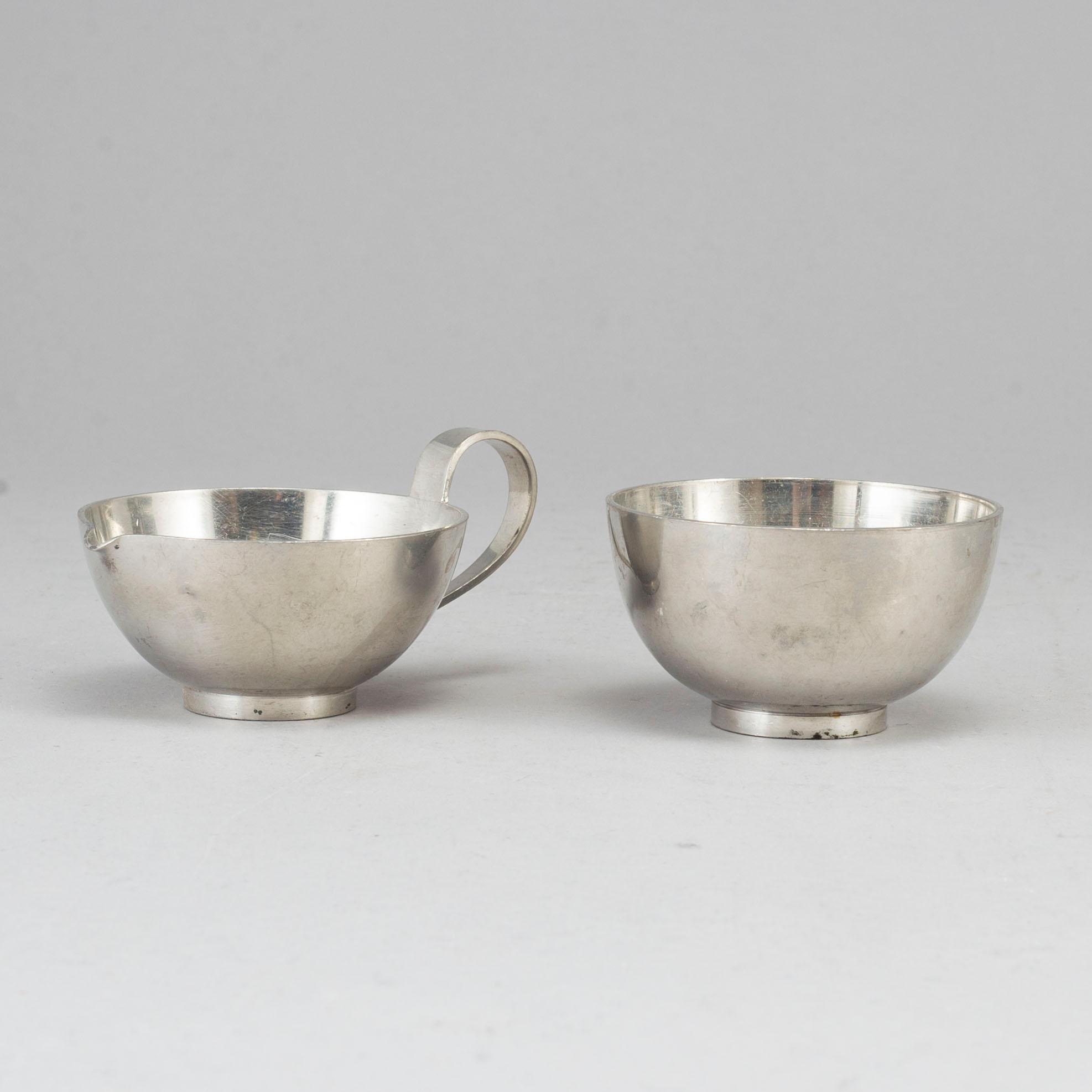 FIRMA SVENSKT TENN, a pewter sugar bowl and creamer. Stockholm 1957.