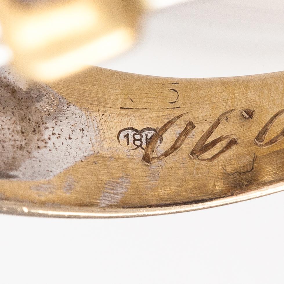 An 18K gold ring with diamonds ca. 0.21 ct in total.