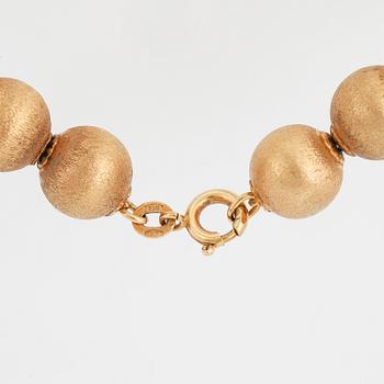 A 18K gold necklace made in Arezzo, Italy.