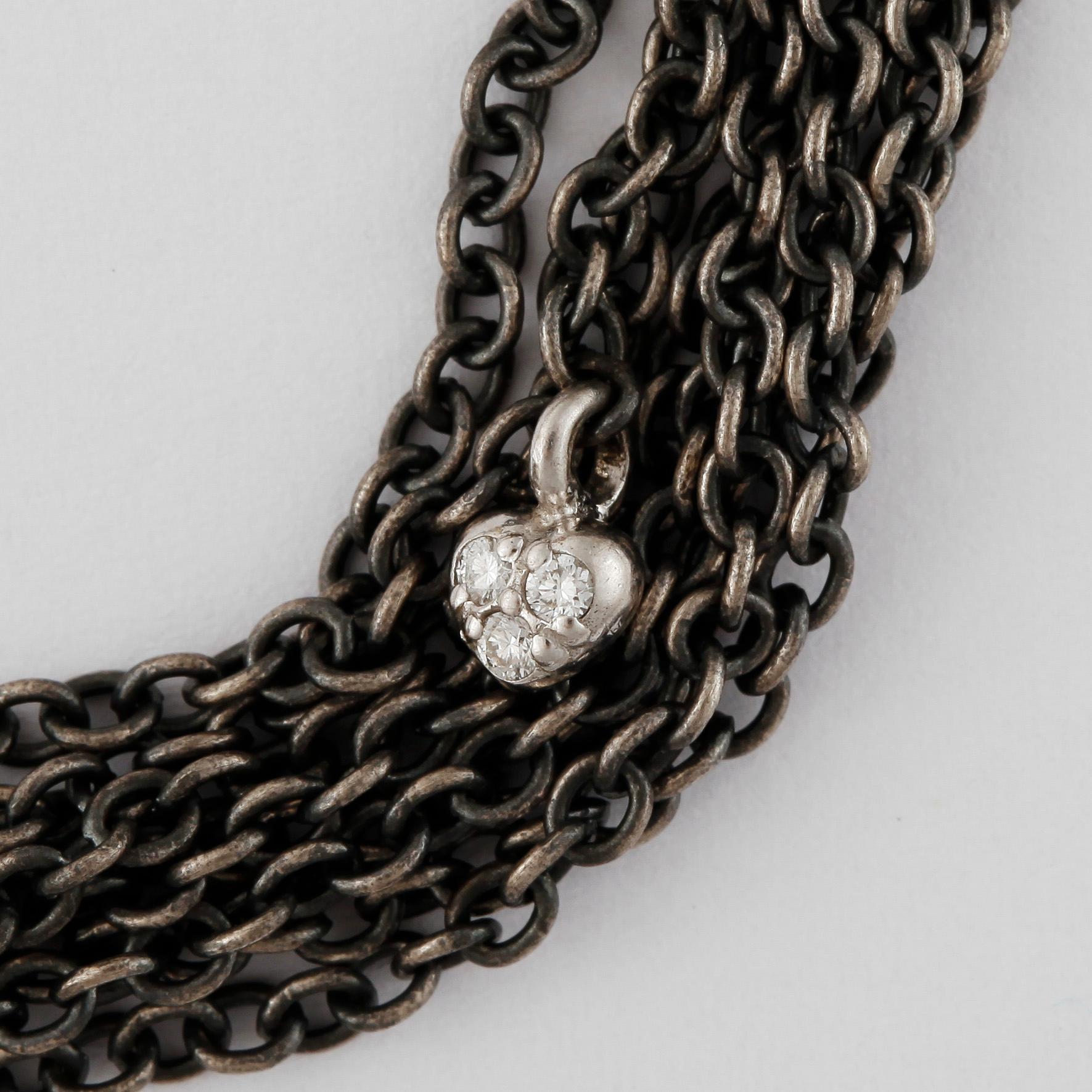 ARMBAND, Ole Lynggaard, oxiderat sterlingsilver och 18k guld och briljantslipade diamanter, lås "Blonde" i 18k guld.