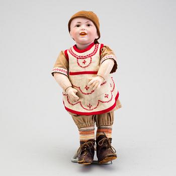 A bisque headed boy doll 235 by S.F.B.J, Paris, France, 1910s.