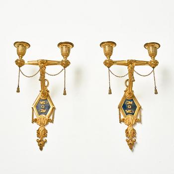 A pair of two-branch late Louis XVI ormolu and blued steel appliques attr. to F. Rémond (bronzier in Paris 1774-1812).