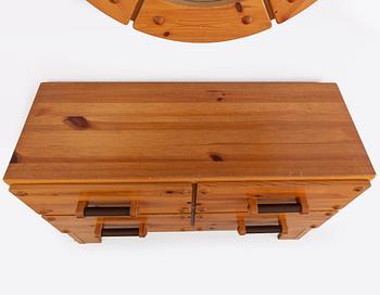 A 1970's set with a pine mirror and chest of drawers.