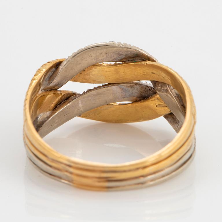 An 18K gold and white gold ring.
