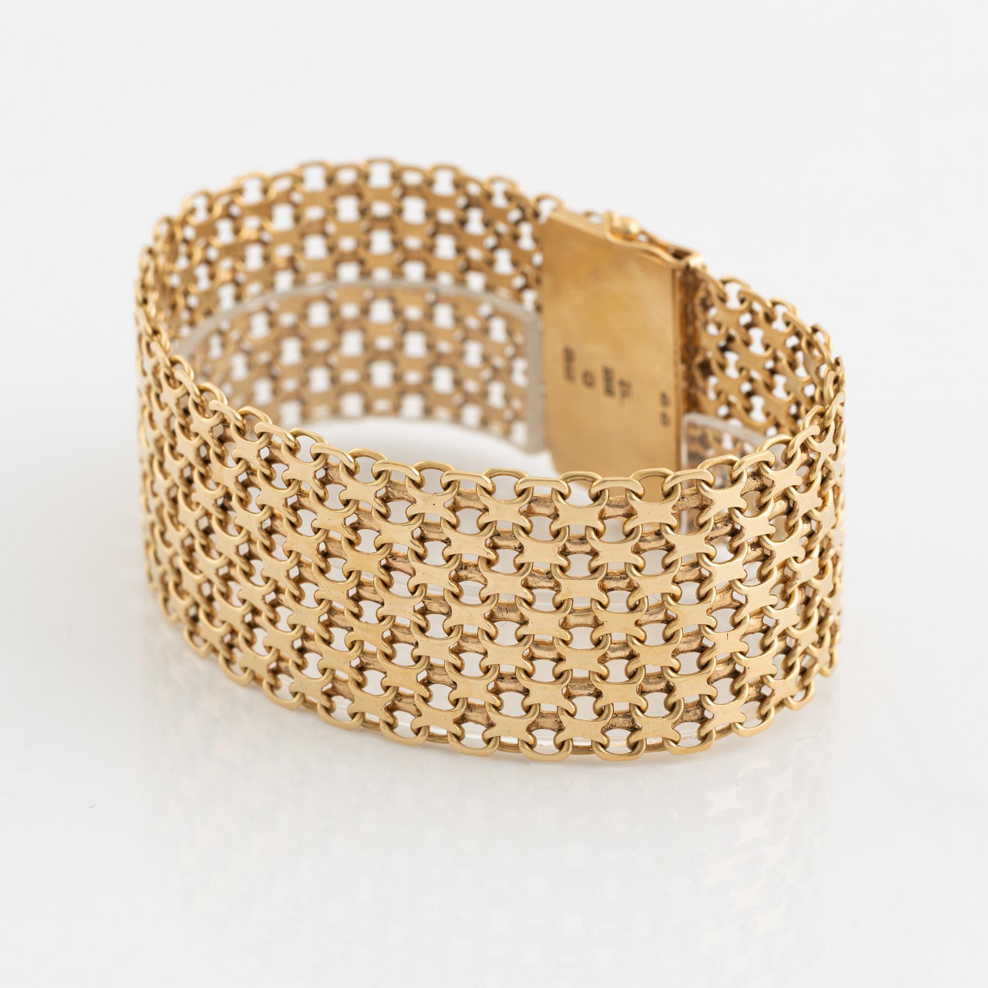 An 18K gold bracelet.