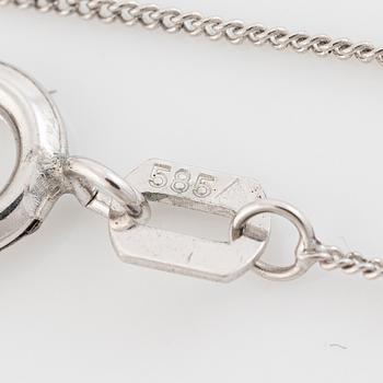 14K white gold necklace with a faceted sapphire.