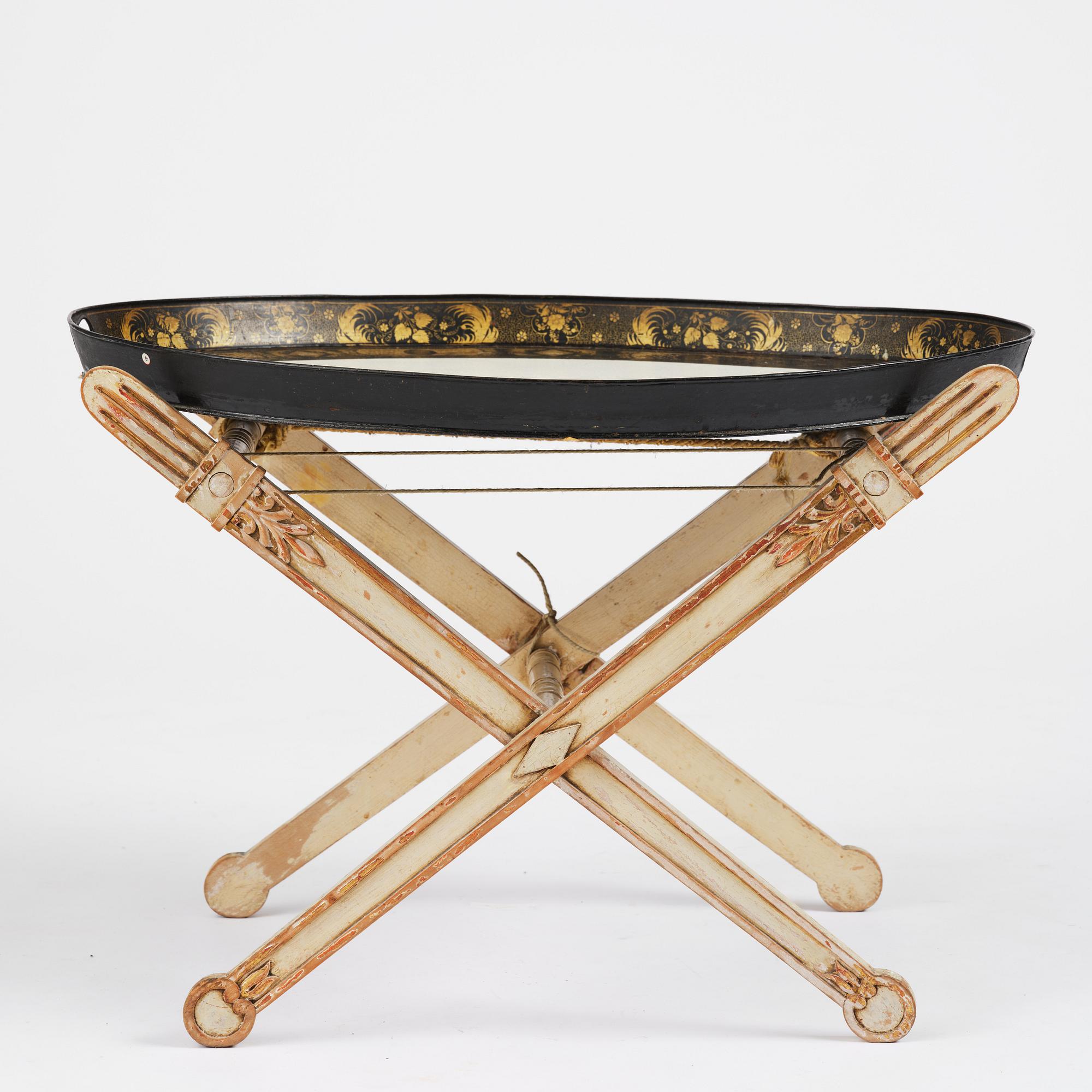 A tole-peinte Empire tray, first part 19th century on a later stand.