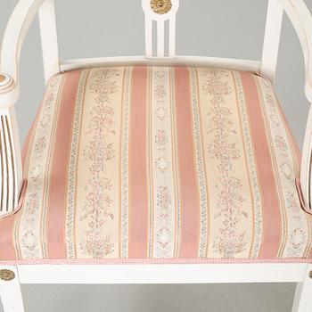Two gustavian style armchairs and three chairs, first half of the 20th century.