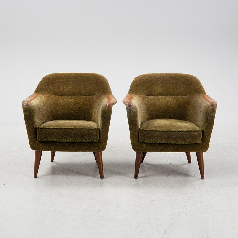 A pair of 1950's/60's armchairs.
