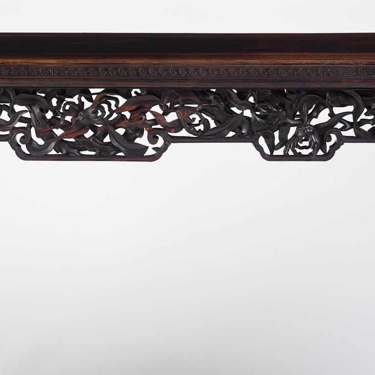 A massive zitan recessed-leg long table 'Jiaotousun Qiotouan', Qing dynasty, 19th century.