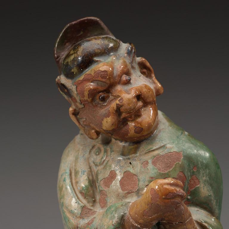 Two green and yellow glazed rofe tile figures, Ming dynasty (1368-1644).